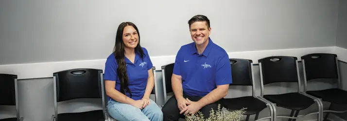 Chiropractor Martinsville IN Curtis Legg Contact us Dr. Curtis Leggan another staff member of Indiana Family Chiropractic Center sitting in the waiting area and smiling